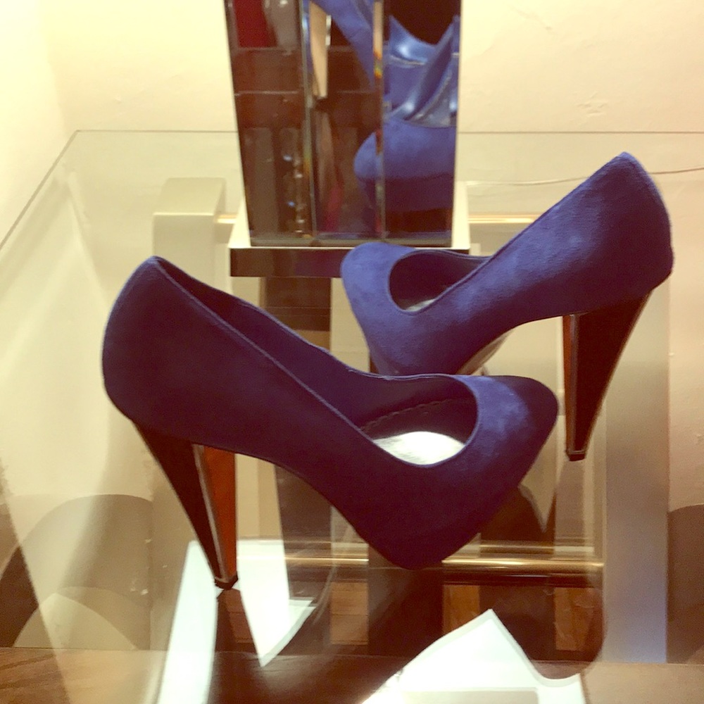 Blue suede shoes with multi color heel..